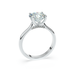 Side view of ÉLODIE ring in white gold showing pavé detail under center stone