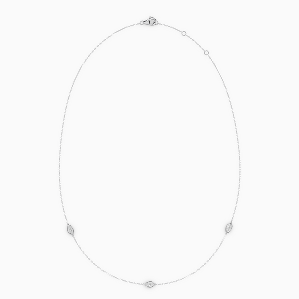 Delicate necklace in rose gold featuring three evil eye–shaped diamond elements spaced along a fine chain, with an adjustable clasp.