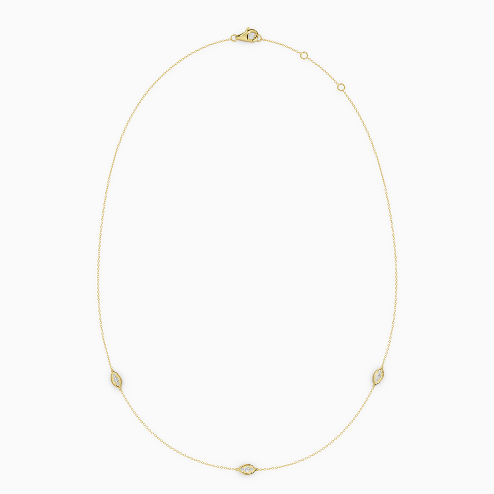 Delicate necklace in rose gold featuring three evil eye–shaped diamond elements spaced along a fine chain, with an adjustable clasp.