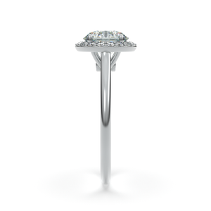 Angled shot of LILOU halo diamond ring in 18k white gold