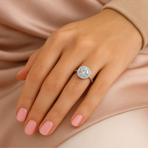 LILOU halo diamond engagement ring in 18k white gold – round brilliant center on model