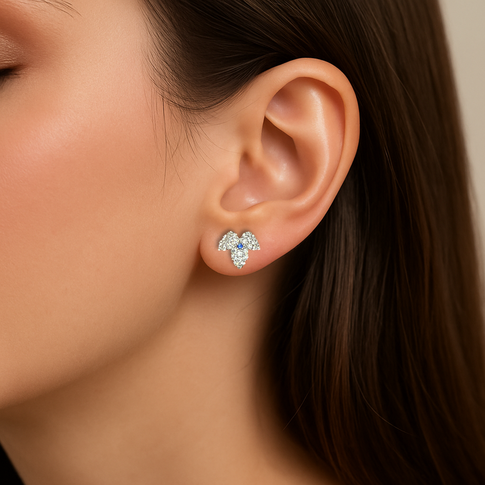 Snowflake-inspired diamond earrings with subtle sapphire accent – CAREDIAMONDS