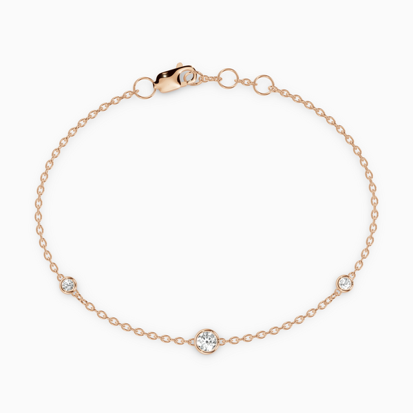 PURE diamond bracelet in rose gold with bezel-set natural diamonds, delicate fine chain design for everyday wear.