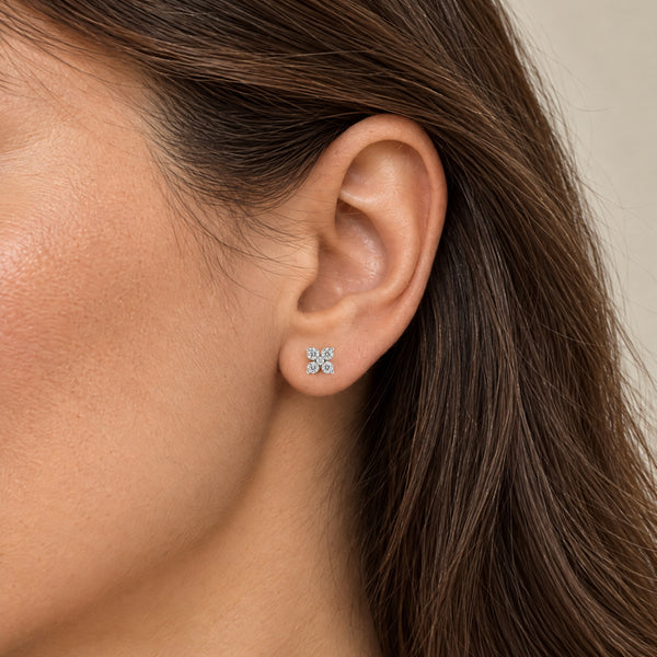 Flower shaped earring white gold on model
