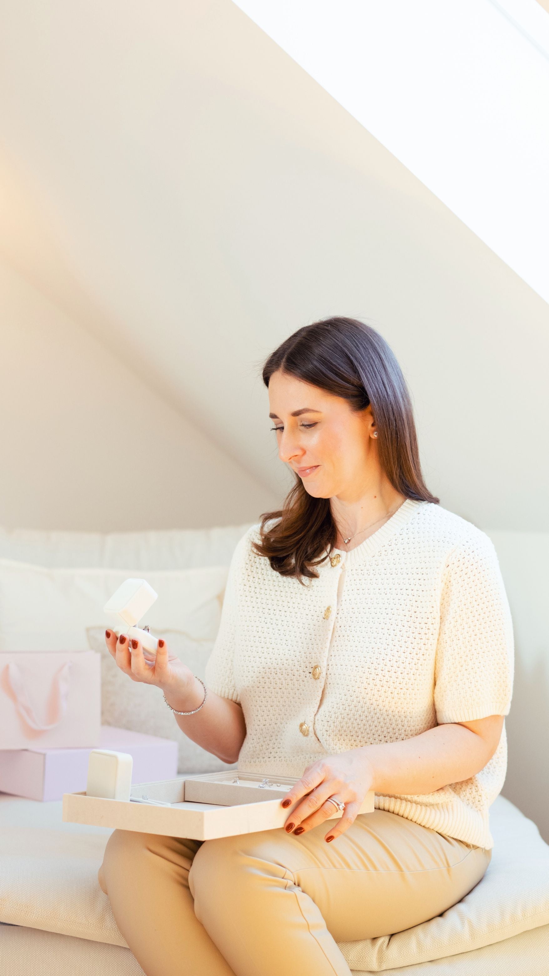 Founder Sarah looking at traceable diamond studs – CAREDIAMONDS authenticity and origin